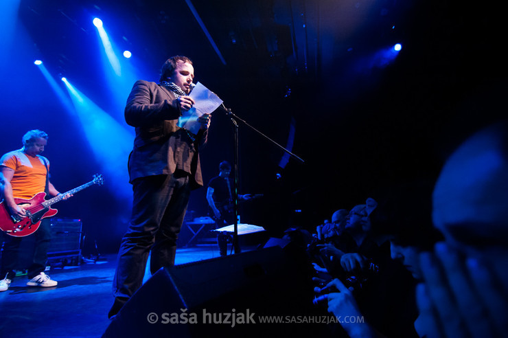 Slovenian poet Dejan Koban reciting on stage with Peter Hook & The Light @ Kino Šiška, Ljubljana (Slovenia), 22/03/2013 <em>Photo: © Saša Huzjak</em>
